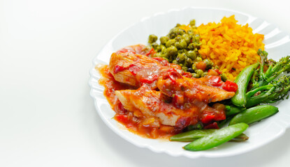 Chicken breast in a tomato and red pepper sauce with spiced long grain rice and crushed minted peas