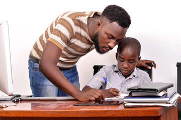 young father studying with his baby boy.