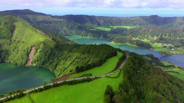 Aerial Panning Scenic View Of Vehicles On Mountains During Sunny Day - Azores, Portugal