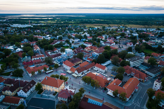 An aerial view of Kuressaare city in Saaremaa island during late August evening. Top drone view of a city by Baltic sea.