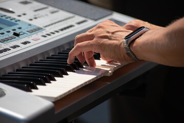 Fototapeta premium Pianist Play The Keys Of The Electronic Piano