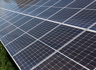 solar panels installed on the ground produce environmentally friendly energy in summer