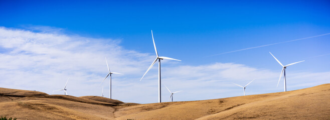 Panoramic view of wind turbines on the top of golden hills in Contra Costa County, East San...