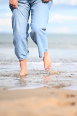 bare feet walking on the beach