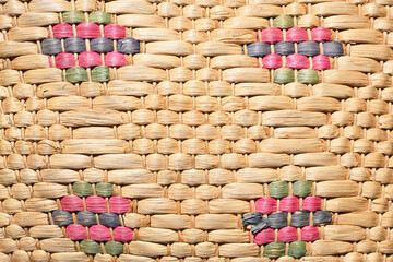 Handmade Wicker and Cattail Weaving. Rural, natural and ecological texture. Colored rhombuses.