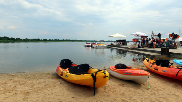 Lake Bukowo. Lake marina. Canoes and pedal boats for rent at the lake marina. Water sports. Dabki, Poland - June 30 2021