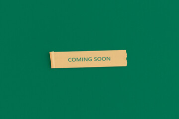 Sticky notes with the text COMING SOON on green background. Store opening concept