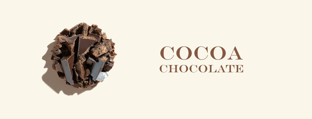 Creative ingredient. Composition with healthy organic product: cocoa chocolate on a ivory...