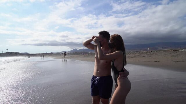Happy young couple at the sea vacations