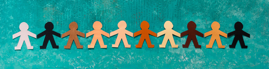 Banner of a multi-ethnic paper dolls chain holding hands against racism