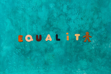 Background with the word Equality written with letters colored as the different tones of human skin