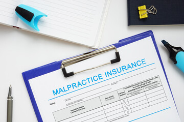 Financial concept meaning MALPRACTICE INSURANCE with inscription on the business paper