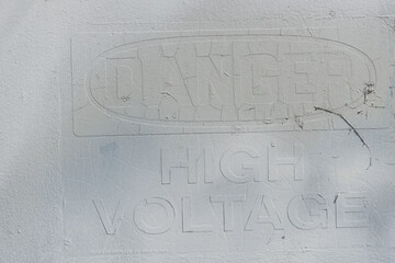 sign on a metal cabinet - reads: Danger High Voltage