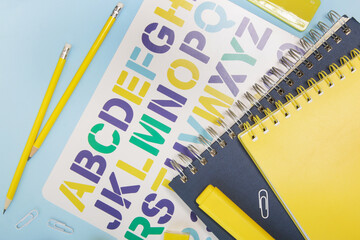 Education and back to school concept: notebooks and school stationery on the table.	