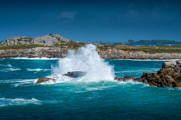 waves crashing on a rock