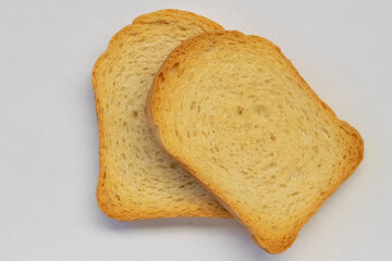two bread toasts with white background. top view