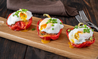 Stuffed peppers with meat with poached eggs