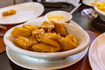 fried polenta with cheese, typical brazilian food on the table