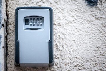 Lockbox, also called keysafe, or key safe, in front of the entrance door of a short term vacation...