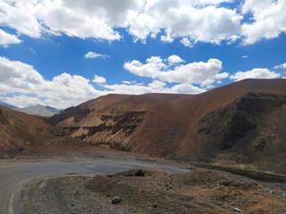 Beautiful red sand and rocky mountain, dark blue sky in leh ladakh, India