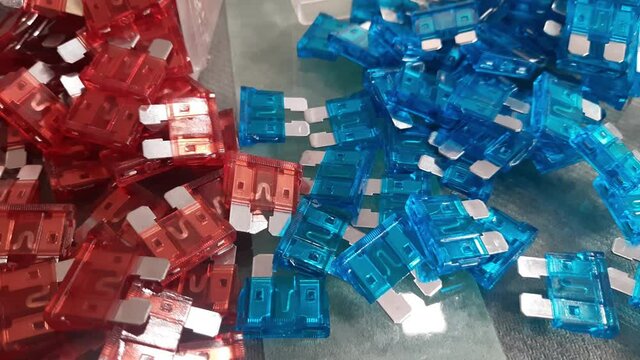 Low voltage circuit breaker Blade Fuse for safety used in Automotive and other industries also color coded for easy Ampire identification, A set of multicolored electronic fuses.