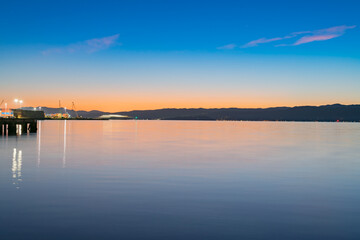 Dawn across Wellington harbour from city waterfront