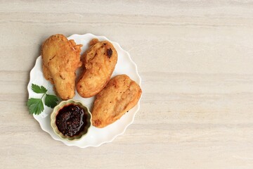 Pisang Goreng Sambal Roa or Fried Banana with Sambal Roa is One of the Typical Culinary Delights from Manado Indonesia, Top View on Marble Background