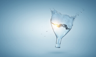 Obraz na płótnie Canvas Water splash out of glass bottle