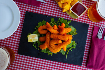 Sepia breaded and fried closeup (chocos, typical tapa in Spain)