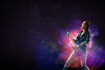 Fototapeta premium Young and beautiful rock girl playing the electric guitar
