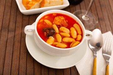 Delicious Fabada asturiana with stewed beans, pork, morcilla and chorizo. Famous authentic regional...