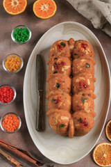 Homemade Rum Christmas Dried Fruit Cake Pudding for Family Party. Served on Brown Cement Table with Dried Sunkist