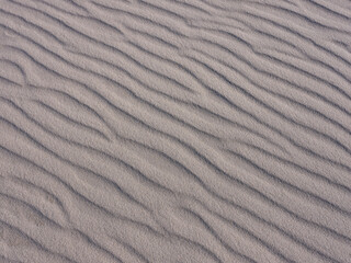 Wind and water patterns carved into the sands of Island Beach State Park in New Jersey with late afternoon light