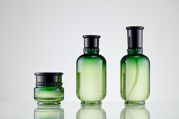 Set green cosmetics on white background. Blank green packaging