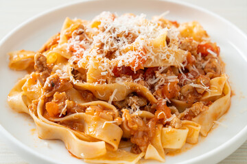 Homemade pasta fettuccine bolognese with cheese