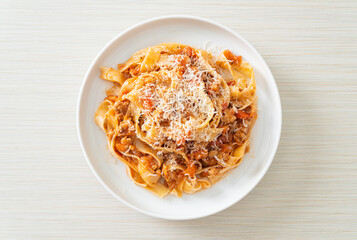 Homemade pasta fettuccine bolognese with cheese
