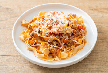 Homemade pasta fettuccine bolognese with cheese