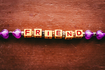 Friendship band with word friend featuring each alphabet with in a cube format. Band for friendship