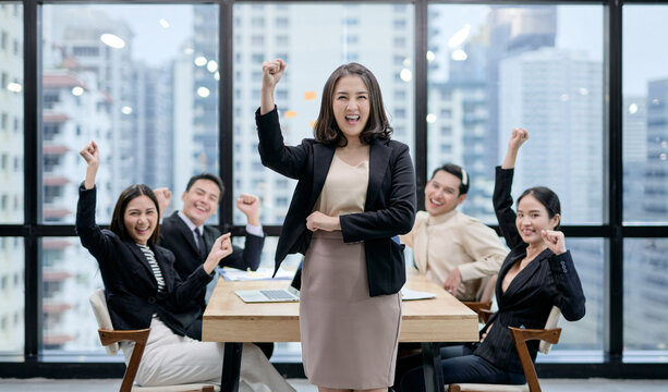 A group of corporate employees are happy with their success. Photo showing workplace gender equality