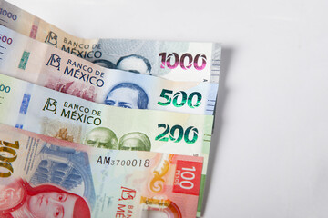 new bank notes of mexican peso background. 100, 200, 500, 1000 pesos