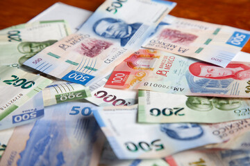 new bank notes of mexican peso background. 100, 200, 500, 1000 pesos