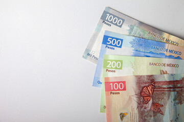 new bank notes of mexican peso background. 100, 200, 500, 1000 pesos