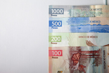 new bank notes of mexican peso background. 100, 200, 500, 1000 pesos - obrazy, fototapety, plakaty