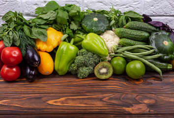 Healthy fresh colored fruits and vegetables background. Space for text. Dietary and balanced vegetarian eating products. Assortment of fresh organic vegetables. Variety of raw vegetables. Fresh food