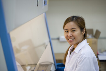 Close up of Smiling scientists looking at camera in laboratory
