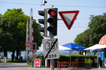 Red traffic light at grade crossing at City of Bregenz on a sunny summer day. Photo taken August...