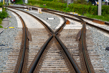 Fototapeta na wymiar Railway tracks with railway switch at City of Bregenz on a sunny summer day. Photo taken August 14th, 2021, Bregenz, Austria.