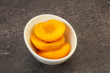 Marinated peaches fruit in the bowl