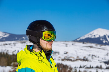 Fototapeta na wymiar man in helmet and ski mask. reflection. winter activity