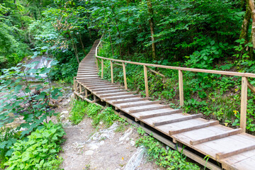 Wooden bridge on a mountain river.